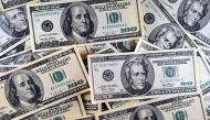 (FILES) This file photo taken on January 30, 2011 shows US currency viewed in Manassas, Virgina. AFP / KAREN BLEIER