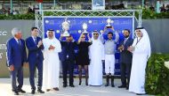 Al Shaqab team officials pose with winner jockey Faleh Bughenaim (3rd right) and the winning trophies in Casablanca, Morocco on Sunday. 