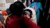 An indigenous woman and her son who were evacuated from their home arrive at the Bluefields Port before the arrival of hurricane Otto in Bluefields, Nicaragua November 23, 2016. REUTERS/Oswaldo Rivas