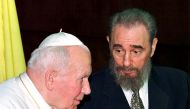Then Cuban President Fidel Castro talks to then Pope John Paul II during the presentation of their delegations at the Palace of the Revolution in Havana in this January 22, 1998 file photo. REUTERS/Paul Hanna