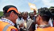 This file photo taken on July 29, 2016 shows Haitian Provisional President, Jocelerme Privert (C), attending the dedication of a new bridge for the Route Soleil 9, at the Cite Soleil neighborhood of Port-au-Prince. Haiti's interim leader Jocelerme Privert
