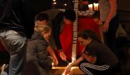 Participants in a prayer vigil at Jacob's Porch are seen praying following the car and knife attack on the campus of Ohio State University in Columbus, Ohio, earlier November 28, 2016. AFP / Paul Vernon