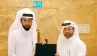Katara General Manager Dr Khalid bin Ibrahim Al Sulaiti (right) giving prize to one of the winners.