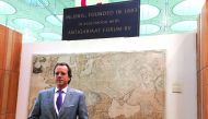 Hugo Wetscherek of Antiquariat Inlibris with an 1803 wall map, the largest of its kind printed for Middle Eastern audience.  Pic: Raynald C Rivera / The Peninsula