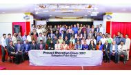 The delegates posing for a group picture.