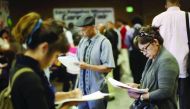 Job seekers fill out applications during the 11th annual Skid Row Career Fair the Los Angeles Mission in Los Angeles, California, US