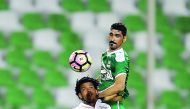 El Jaish's Romarinho (front) vies for the ball with Al Ahli player during their Qatar Stars League match at Al Ahli Stadium, yesterday. Pictures by Kammutty VP/  The Peninsula 
