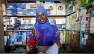 A woman smiles in her shop in Serekunda, Gambia December 3, 2016. REUTERS/ Thierry Gouegnon