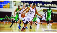 Al Rayyan's Mohamed Hassan dribbles the ball during their game against Al Ahli at Al Gharafa Sports Club Indoor Hall yesterday. Al Rayyan won by 93-75.