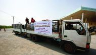 Volunteers in a Qatar Charity aid vehicle in Tihama city of war-torn Yemen.