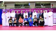 The champions of the ITTF World Tour Grand Finals, Doha pose for a photograph with International Table tennis Federation and Qatar Table Tennis Association officials at the Ali Bin Hamad Al Attiyah Arena yesterday.    Pictures by Kamutty VP and Mohamed Fa