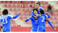 Al Rayyan's Sebastian Soria (left) and Mohammed Alaeddin Abdalmtaal celbrate the goal scored by Koh Myong Jin (centre) against duringtheir Qatar Stars League match at At Grand Hamad Stadium in Doha, yesterday.