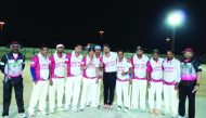 The Qad Net Qatar Team players pose for a photograph with Sreesanth during the opening day of the tournament.