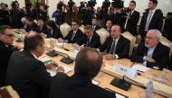 Russian Foreign Minister Sergei Lavrov (2L), his Turkish counterpart Mevlut Cavusoglu (2R) and Iran's Foreign Minister Mohammad Javad Zarif (R) attend a meeting in Moscow on December 20, 2016.  AFP / Natalia KOLESNIKOVA
