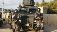 Jordanian security forces are seen on december 19, 2016 during the funeral of victims who were killed a day earlier in an attack at in Karak, a tourist destination, around 120 kilometres (70 miles) south of the capital Amman, during his funeral near the t