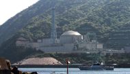 (FILES) This file picture taken on May 6, 2010 shows a police boat on patrol near the Monju fast-breeder nuclear reactor plant in Tsuruga, Fukui prefecture.  AFP / JIJI PRESS
