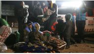 Syrians wait to be evacuated from the east part of Aleppo that had been under siege by Assad Regime forces and its supporter foreign terrorist groups at a crossing point at Rashideen town of Aleppo in Syria on December 19, 2016. ( Aref Watad - Anadolu Age