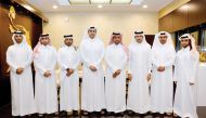 Hamad bin Abdulrahman Al Attiyah (fourth right), the President of QEF board poses for a photo with the new board members during the annual QEF meeting held in Doha, yesterday. 