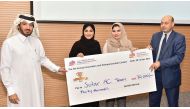 Some winners of the innovation contest receiving the prize money.