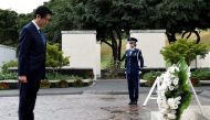 Japanese Prime Minister Shinzo Abe bows his head after presenting a wreath at the National Memorial Cemetery of the Pacific at Punchbowl in Honolulu, Hawaii, U.S. December 26, 2016. REUTERS/Hugh Gentry
