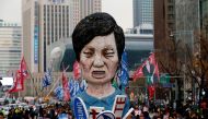 Members of Korean Confederation of Trade Unions march with an effigy of President Park Geun-hye during a general strike calling for Park to step down in central Seoul, November 30, 2016 (REUTERS / Kim) 