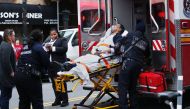 A commuter train derailed Wednesday at a station in Brooklyn and injured nearly 80 people, officials said, setting off a panic during the morning rush.  AFP / Kena Betancur
