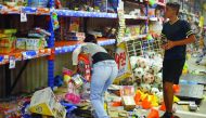 People pick up toys as they loot a store during a protest in the port of Veracruz, Mexico, yesterday.