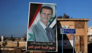 A picture of President Bashar al-Assad is seen in Ramouseh, Aleppo, Syria, December 8, 2016 (REUTERS / Omar Sanadiki) 