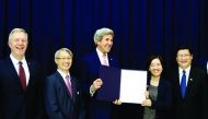 Secretary of State John Kerry presents a Letter of Intent (LoI) to Dam Bich Thuy, President of Fulbright University Vietnam, at Ho Chi Minh University of Technology and Education in Ho Chi Minh City, Vietnam, yesterday.
