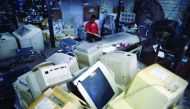 A worker sorting out electronic waste from discarded computer goods at Scrap Computing Trading (SCT) in Shah Alam on the outskirts of Kuala Lumpur. 
