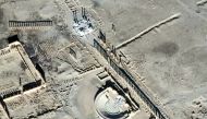 This handout picture provided on January 20, 2017 by UNITAR-UNOSAT and taken on January 10, 2017, shows a close-up of a satellite-detected image of the damaged Roman tetrapylon (top) and amphitheatre (C) in the ancient city of Palmyra in central Syria.  A