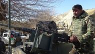 A member of the Afghan security forces keeps watch following clashes with ISIS fighters in Kot District in eastern Nangarhar province on February 6, 2016. AFP PHOTO.