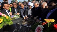 Sheikh Abdul Mahdi al-Karbalai (C), the representative of Iraq's Shiite spiritual leader Grand Ayatollah Ali Sistani who is in charge of the Imam Hussein Holy Shrine, and Sami al-Araji (C-R), head of Iraq's National Investment Commission, lay the cornerst