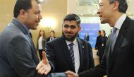Chief opposition negotiator Mohammad Alloush (C) of the Jaish al-Islam (Army of Islam) rebel group arrives to attend the first session of Syria peace talks at Astana's Rixos President Hotel on January 23, 2017. / AFP / Ilyas Omarov
