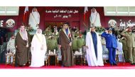 Emir H H Sheikh Tamim bin Hamad Al Thani at the graduation ceremony of the 12th class of officer cadets of the Ahmed bin Mohammed Military College, yesterday.