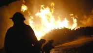 Firefighters work to extinguish blaze inside Mallorca Forest Company in San Ramon, 240km south of Santiago, yesterday.