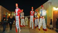 Stilt walkers entertain visitors at Wakrah Souq during the Spring Festival, yesterday. Pic: Abdul Basit/The Peninsula