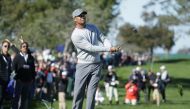 Tiger Woods plays his shot on the ninth hole during the second round of the Farmers Insurance Open at Torrey Pines North on January 27, 2017 in San Diego, California. Jeff Gross/AFP