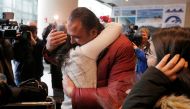 Banah Alhanfy is greeted by her uncle (R) at Logan Airport after she cleared US customs and immigration on special immigrant visa in Boston, Massachusetts, U.S. February 3, 2017. Reuters/Brian Snyder
