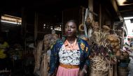 Essie Bartels walks at the Makola market in Accra, on January 25, 2017. AFP / Ruth McDowall