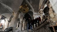 People take a selfie inside Aleppo's Umayyad mosque, Syria January 31, 2017. Picture taken January 31, 2017. REUTERS/Omar Sanadiki
