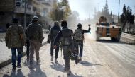 Free Syrian Army members move forward to the center of Al-Bab district during the 