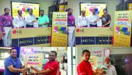 Winners of Jumbo Electronic's Scratch & Win promotion receiving prizes. 