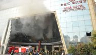 Firefighters are seen at the site after a fire broke out at HNA Hotel in Nanchang, Jiangxi province, February 25, 2017. REUTERS/Stringer