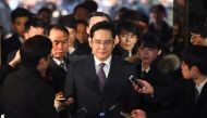 In this file photo, Samsung Group's heir-apparent Lee Jae-Yong (C) arrives at court for a hearing to review the issuing of his arrest warrant at the Seoul Central District Court in Seoul on January 18, 2017. Jung Yeon-Je/AFP