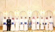 Students and officials of Qatar Chemical Company Ltd, at the graduation ceremony.