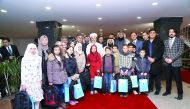 RAF officials with Syrian students who received the textbooks.