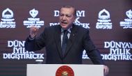 Turkish President Recep Tayyip Erdogan gestures as he speaks in Istanbul on March 12, 2017. Turkey's President Recep Tayyip Erdogan on March 12 threatened that the Netherlands would 