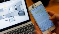 CEO of Unified Inbox Toby Ruckert demonstrates how he uses his smartphone to control electrical appliances in a simulation software in Singapore March 3, 2017. REUTERS/Edgar Su