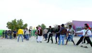 Workers participate in “Raeyana Campaign” at Al Shahaniya organised by Qatar Charity.